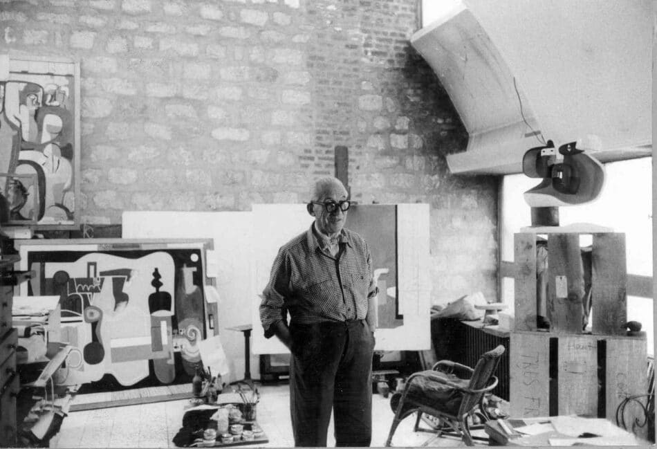 Le Corbusier in his Paris apartment