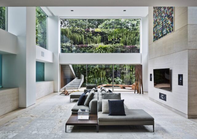 This Refined São Paulo Duplex Has a Swimming Pool in the Living Room Wall