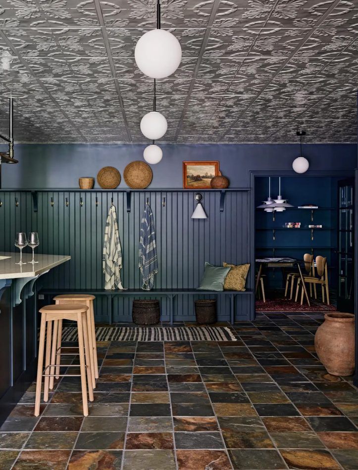 The home bar sits right in the entry of a Scandinavian-inspired lake house in Connecticut by Bespoke Only.