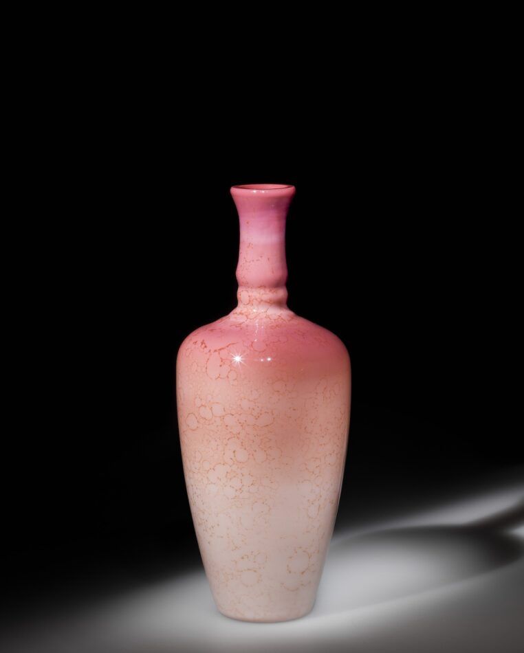 A pink vase with a mottled finish in the exhibition "Brilliant Color" at the Corning Museum of Glass