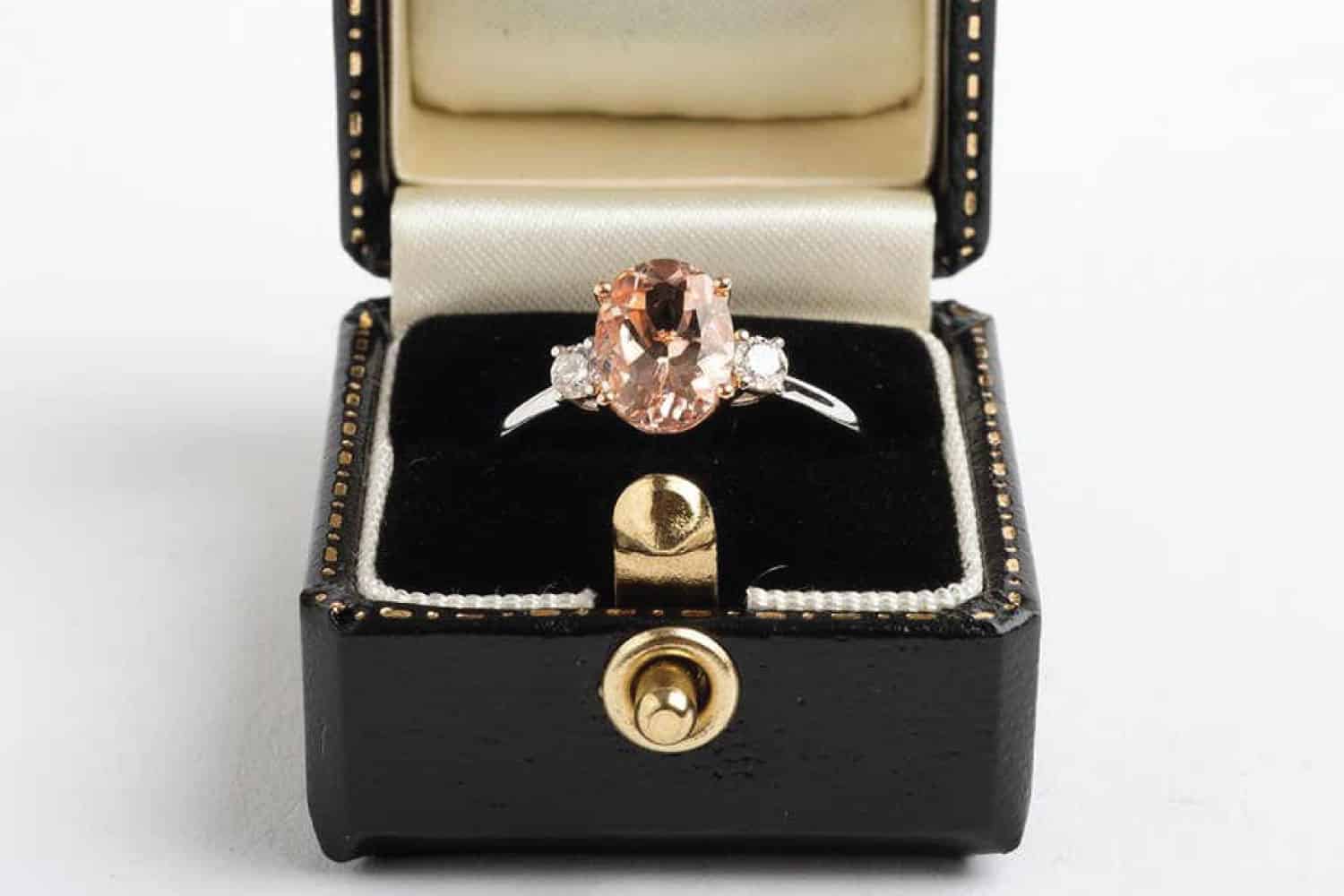 Morganite cluster ring with two brilliant-cut diamonds