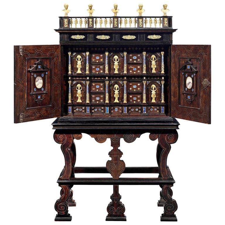 A 17th-century cabinet of curiosities features ebony wood and gilt bronze details.