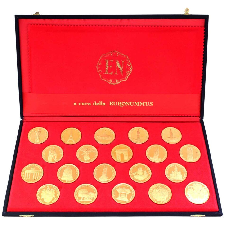 Red box with 20 gold coins, with each coin showing the first 20 Olympic Games, including locations, city landmarks, and the Olympic Torch Bearer