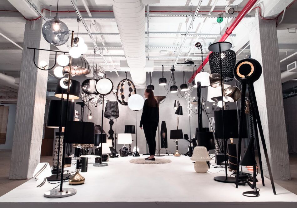 A visitor activates the "Enlightened" display at the 1stdibs Gallery.