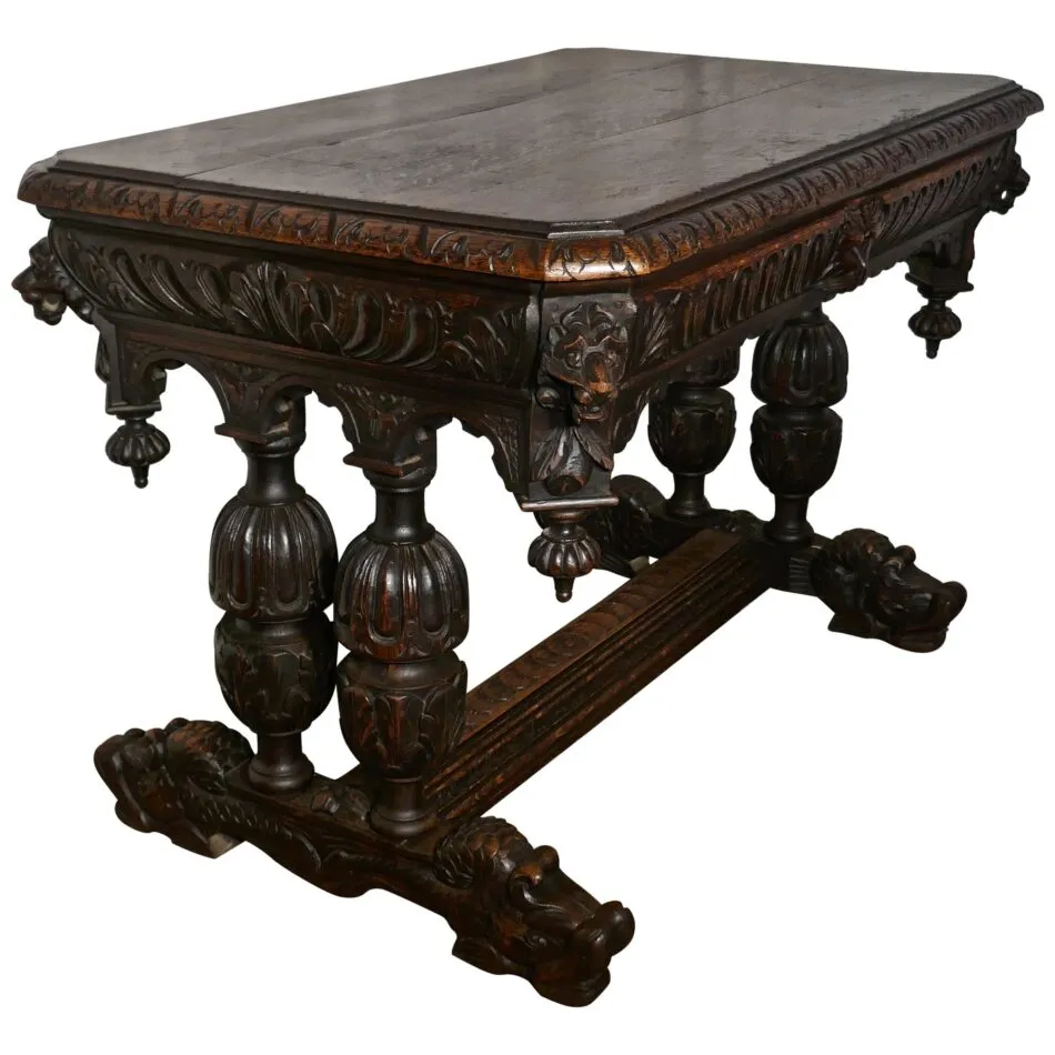 This dark oak rectangular table from the 19th century has ornately carved designs in the Gothic style.
