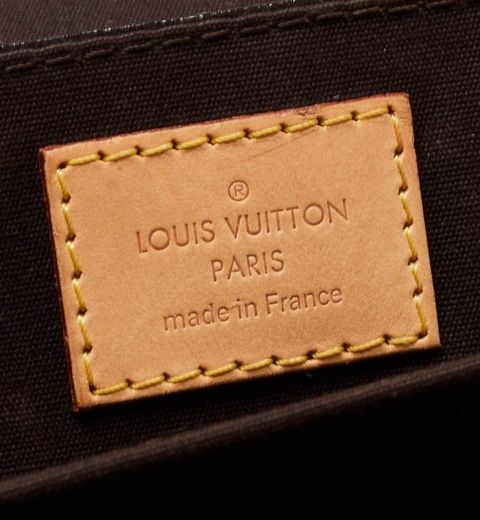 A photograph of an authentic Louis Vuitton stamp on a Miranda Bag. 