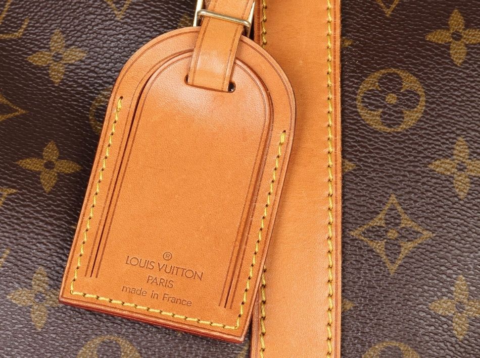 A close up photograph of the meticulous stitching on a Louis Vuitton Keepall Travel Bag from 1995. 