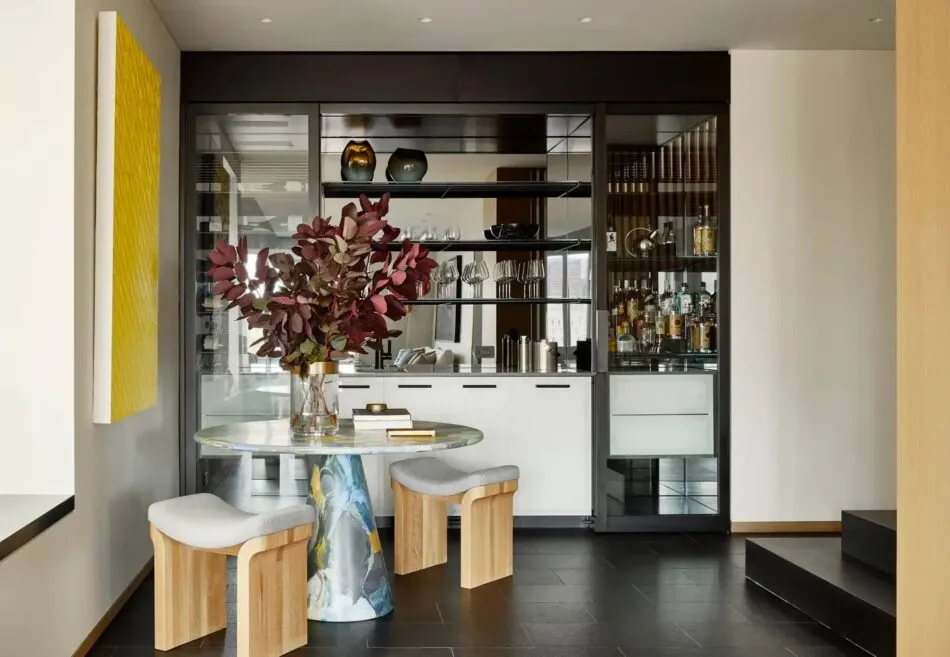 Workshop APD designed this bar area of a Manhattan triplex apartment, complete with a Dirk Van Der Kooij Melting Pot table.