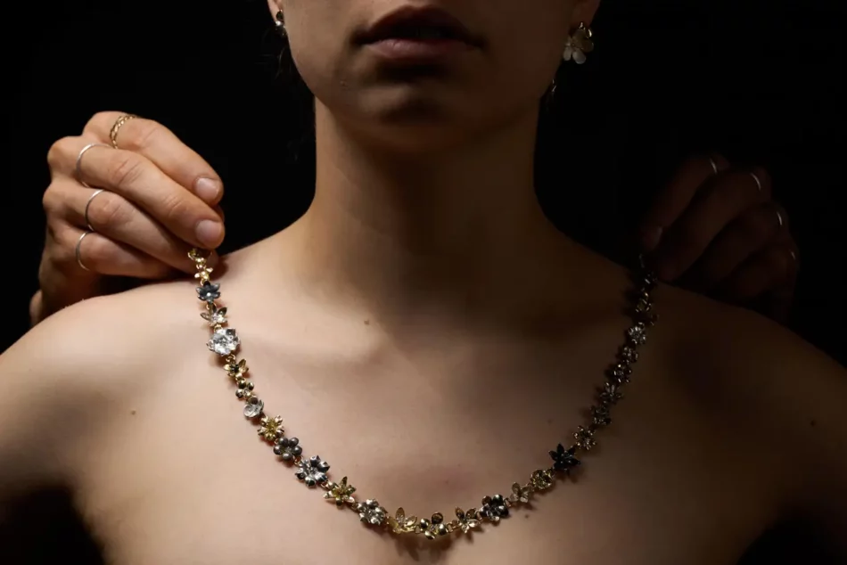 Gold and diamond floral La Luce necklace on a model