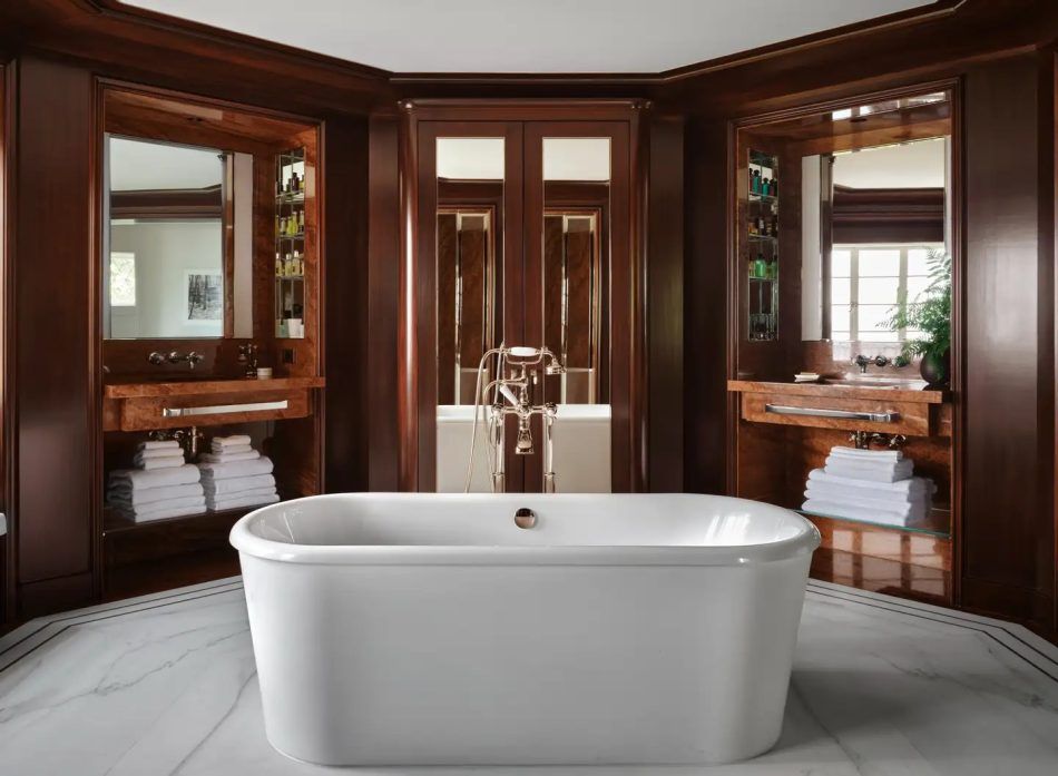 In a mahogany-lined Seattle bathroom, Clive Lonstein created a hexagonal space around a freestanding tub.