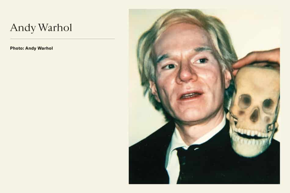 Portrait of Pop Artist Andy Warhol with skull on his shoulder