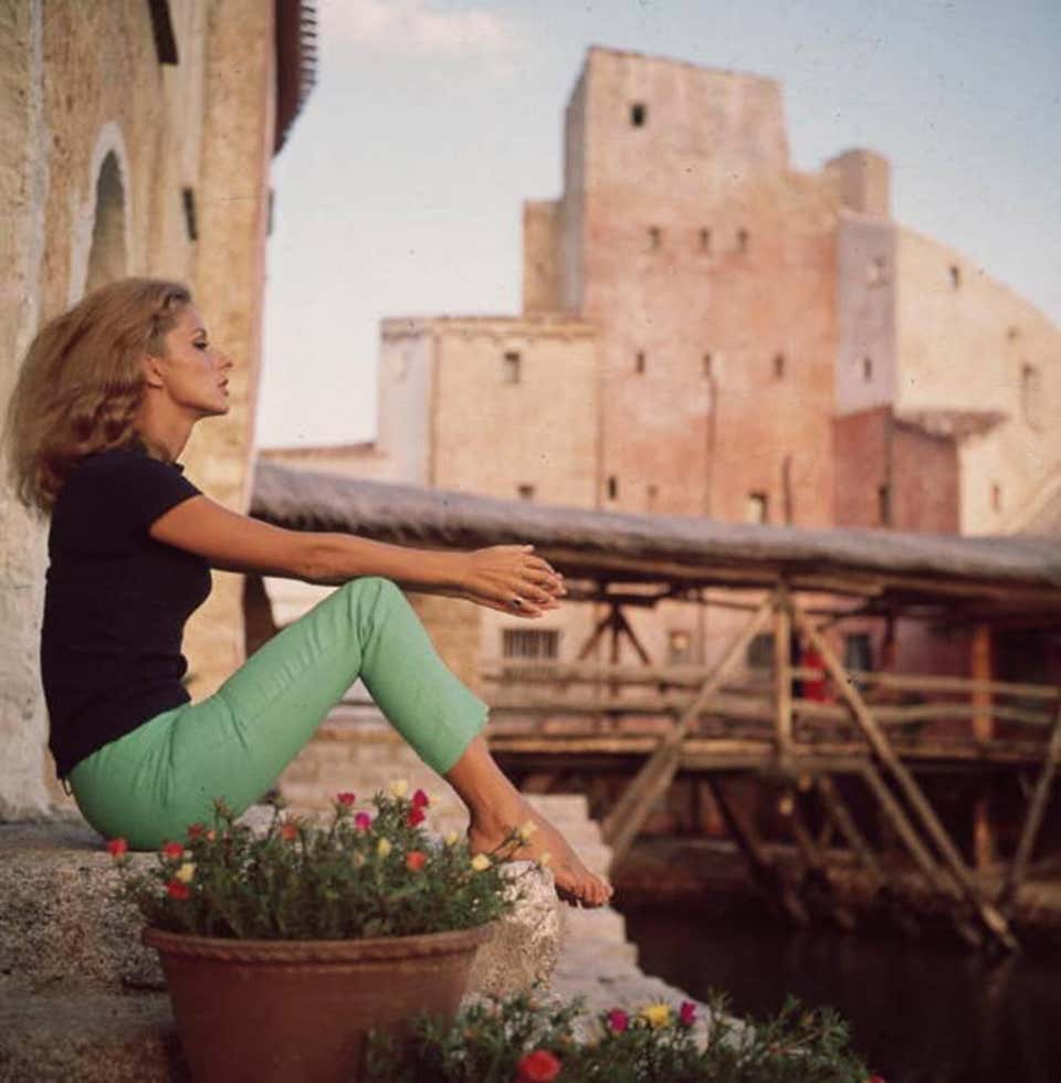 Model from the 1960s presenting an outfit with capri trousers and shirt  Italy Stock Photo  Alamy