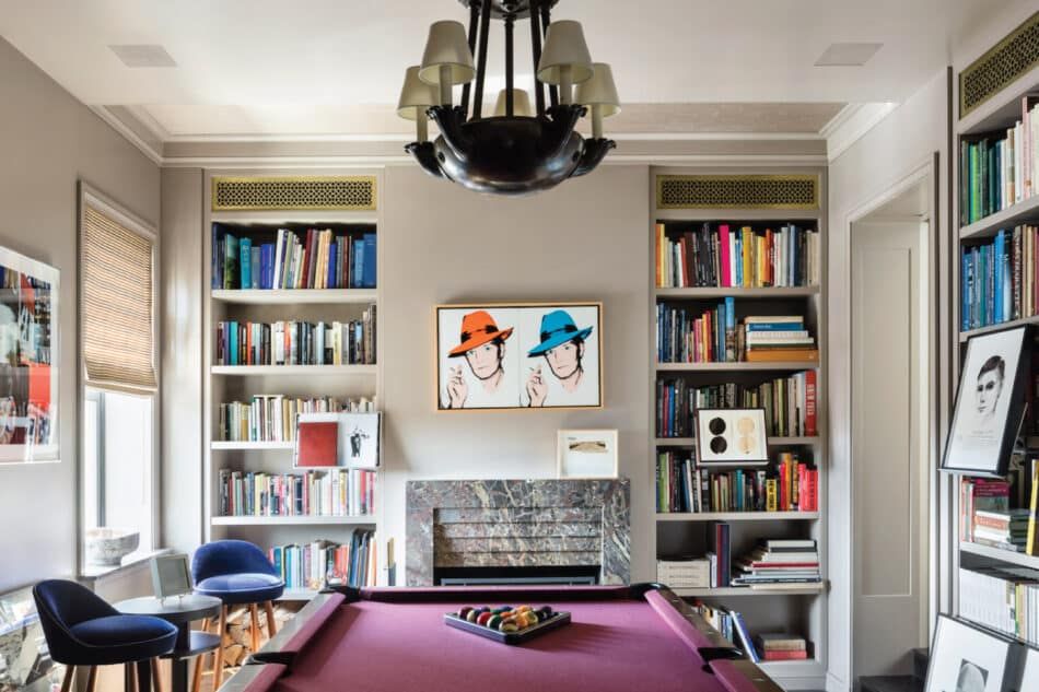 A billiards room designed by Thad Hayes features a Warhol double portrait of Truman Capote over the fireplace.