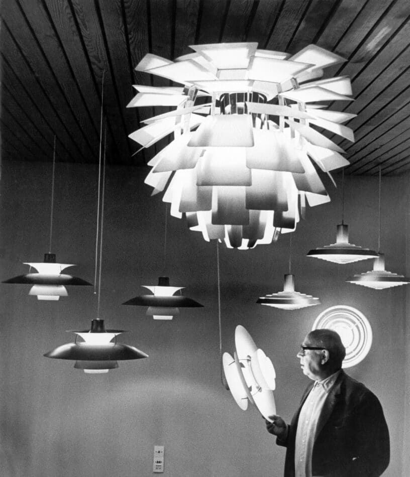 Poul Henningsen, photographed in 1957 among several of his designs, as seen in the book Danish Lights