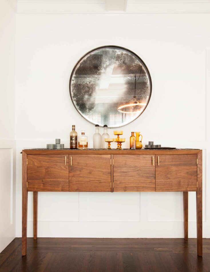 Streamlined bar console in an Oakland home by Geremia Design