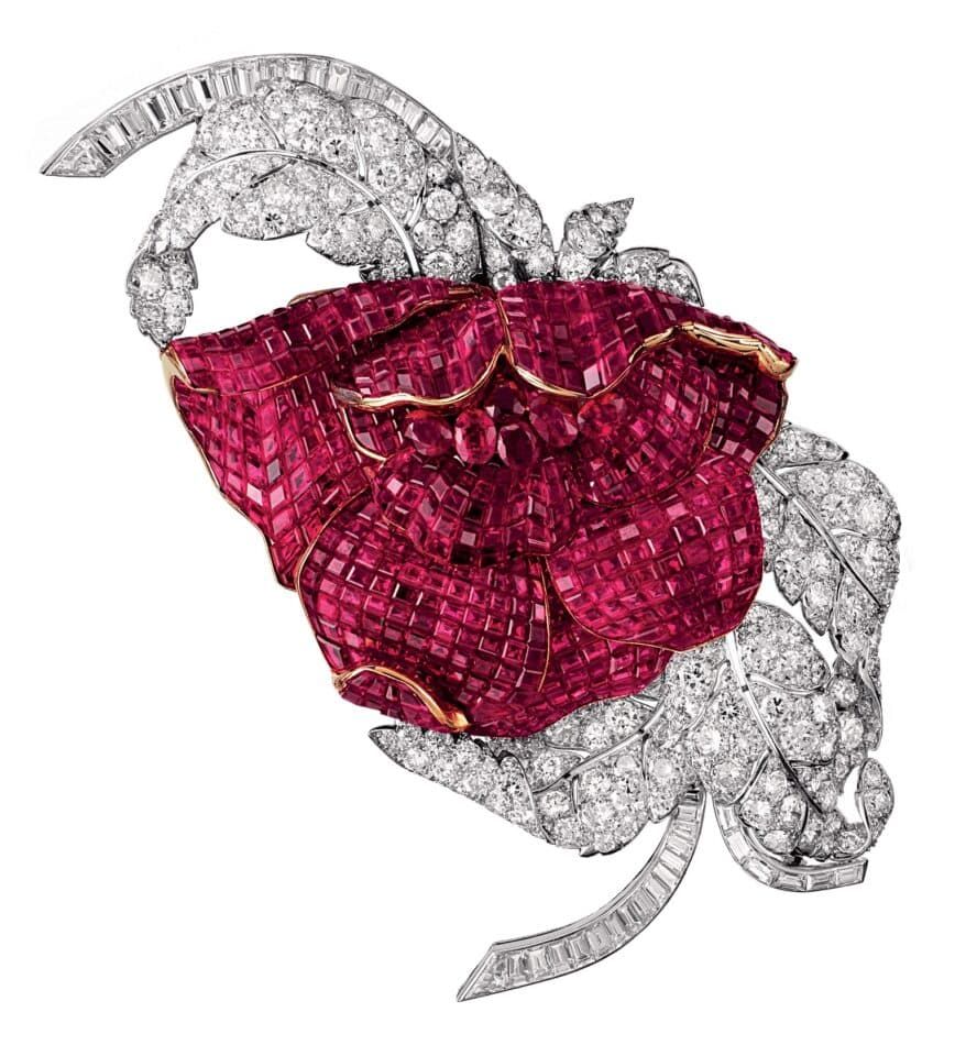 A 1937 Van Cleef & Arpels peony clip featuring curved petals with Mystery Set rubies