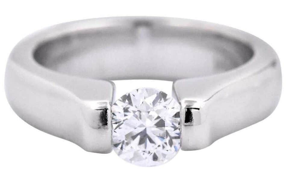 A tension-set diamond engagement ring made with white gold