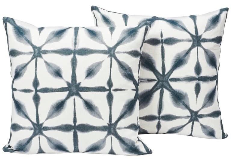 Schumacher's Andromeda pillows have a shibori-style pattern indigo white linen.