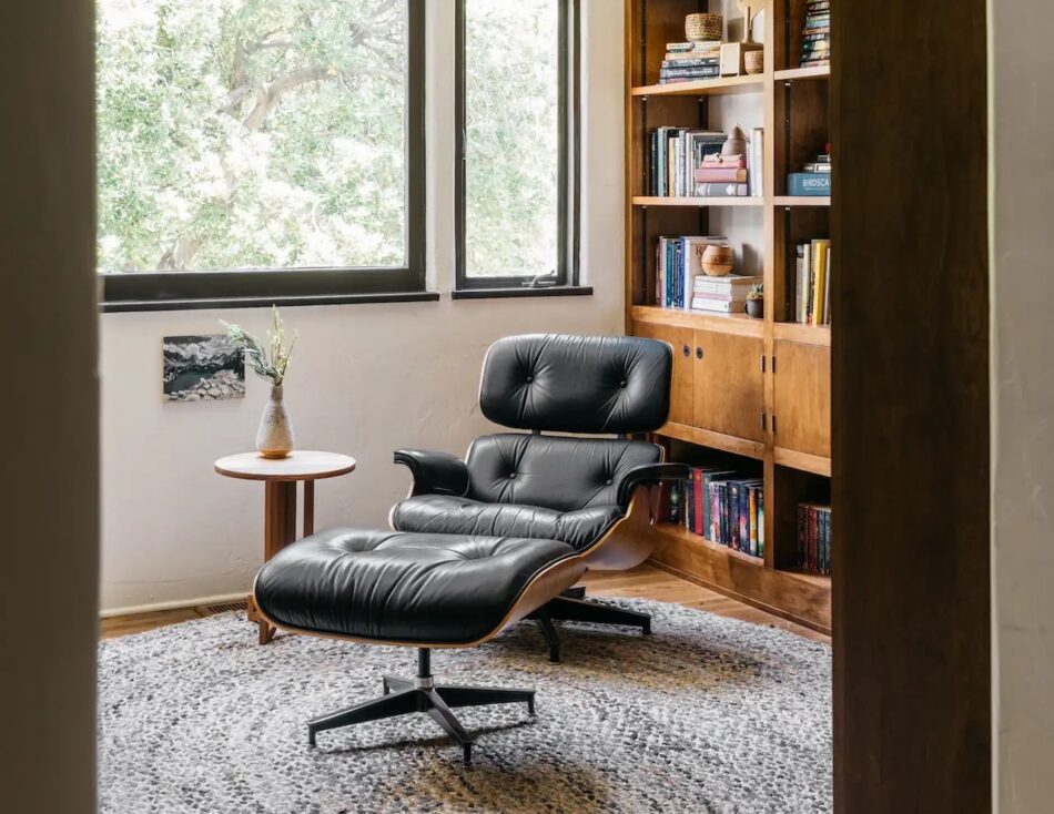 An Eames Lounge Chair and Ottoman by the window in the study of an Altadena, California, home designed by A1000xBetter