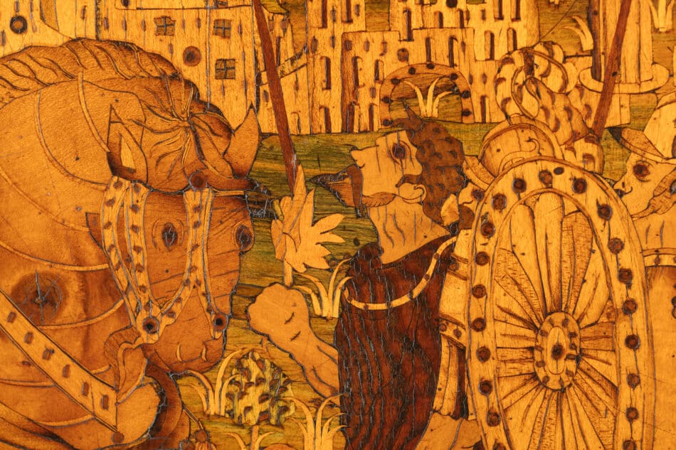 Detail of a soldier with a horse on a 19th-century French desk with German marquetry, offered by Adrian Alan 