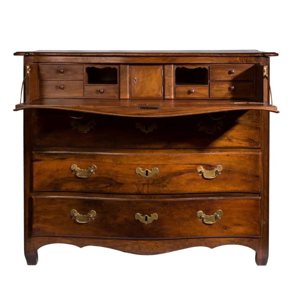 A walnut serpentine-front butler's desk with the drop-leaf down