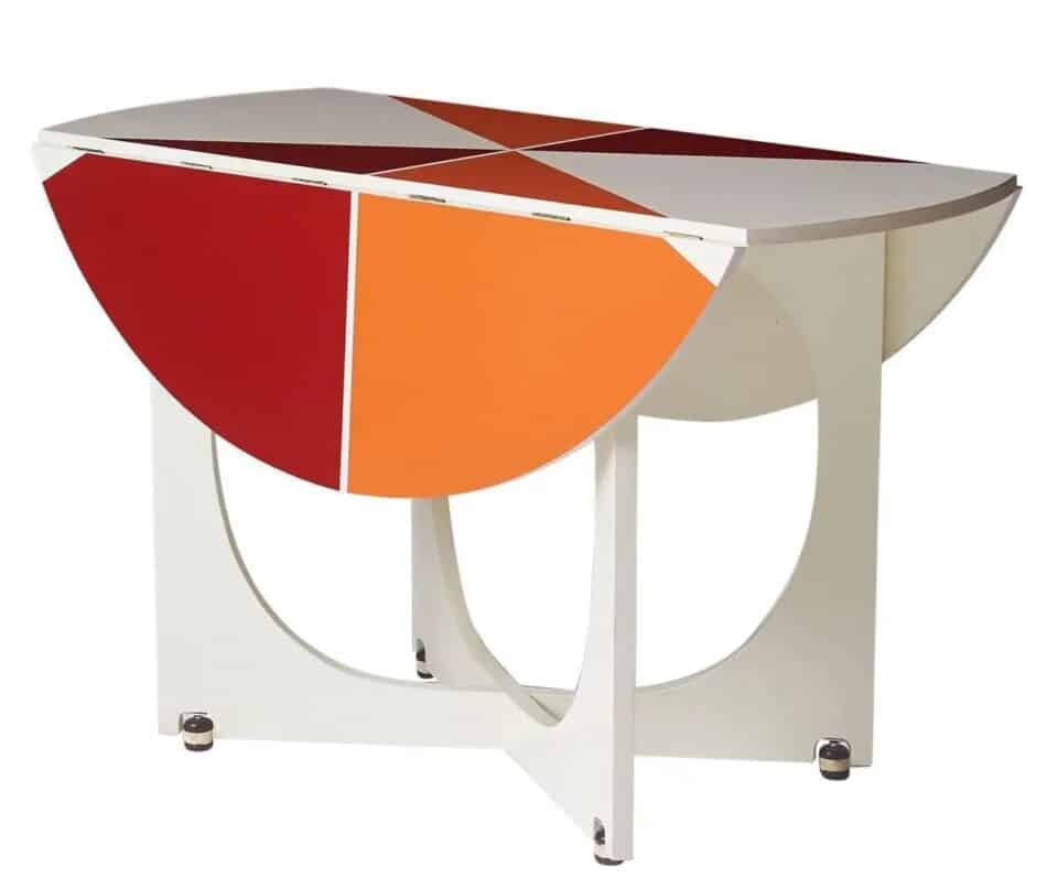 Gio Ponti Round, white drop-leaf table with a geometric red, orange and white design on the tabletop.
