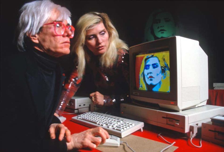 Andy Warhol with Debbie Harry and His Amiga Computer, 1985, by Allan Tannenbaum