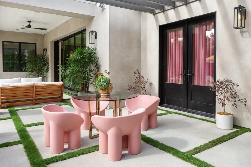 Patio with pink seating outside a Los Angeles home designed by Argyle Design