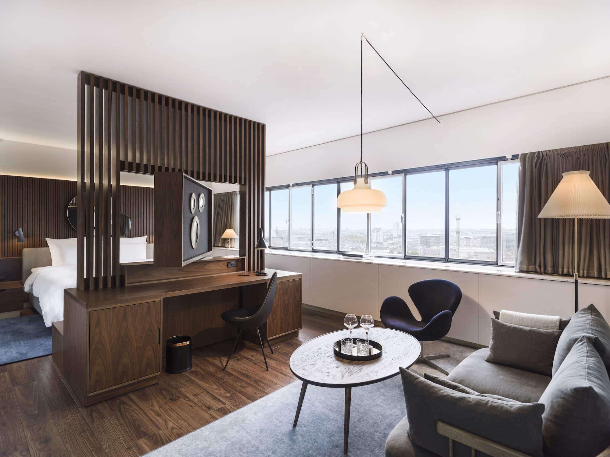A modernist guest room at the Radisson Blu Royal Hotel in Copenhagen designed by Arne Jacobsen