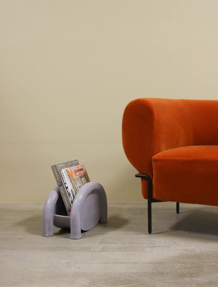 BZippy Magazine Rack in Lavender Milky Way next to orange seating