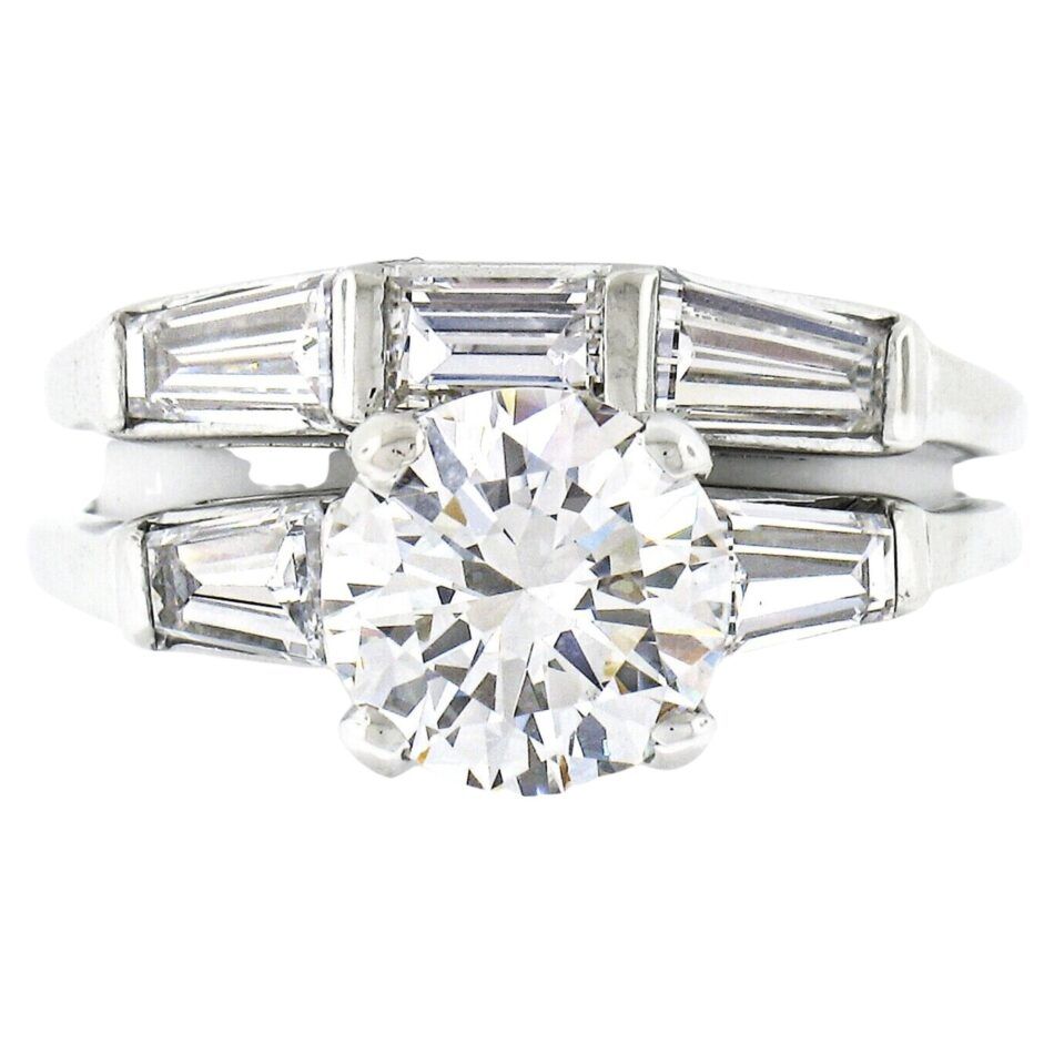 A vintage diamond baguette engagement and wedding ring set made with white gold