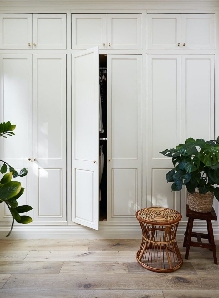a white storage room with tall cabinets