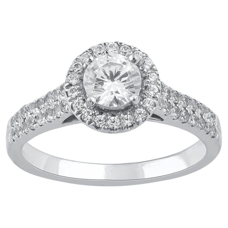 A brilliant cut round diamond ring with a white gold halo