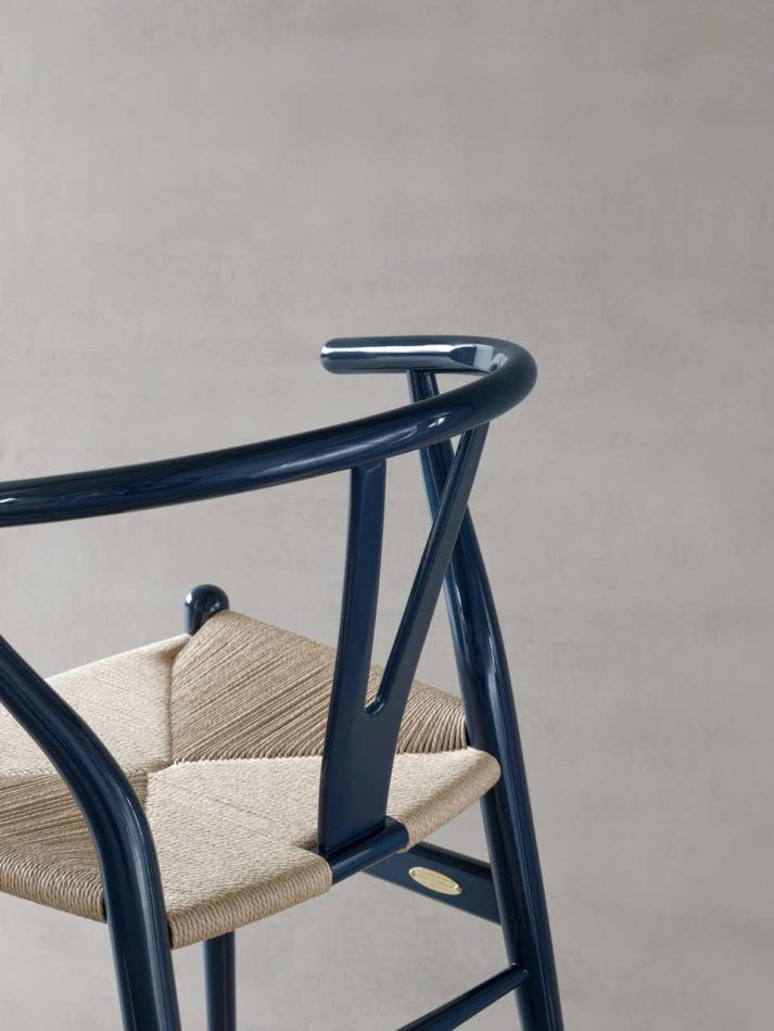 The 70th anniversary Wishbone chair with a glossy navy finish.