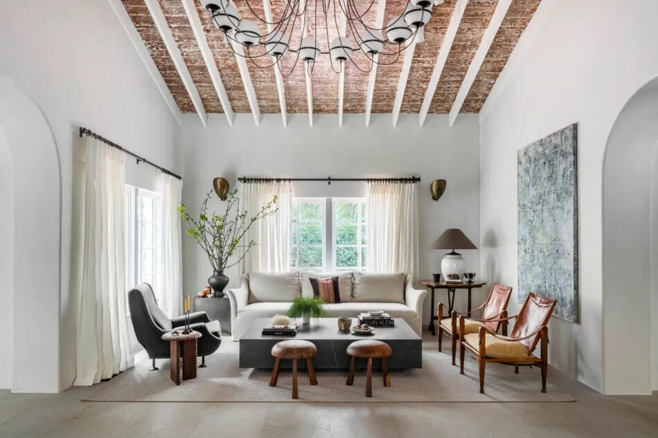 The living room of Mediterranean-style villa in Miami by Collarte Interiors