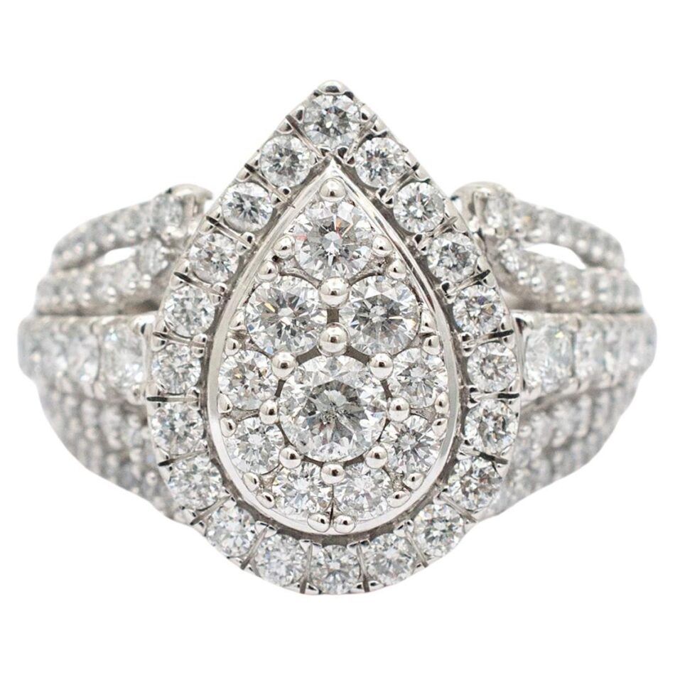 A white gold diamond cluster ring with a pear shape