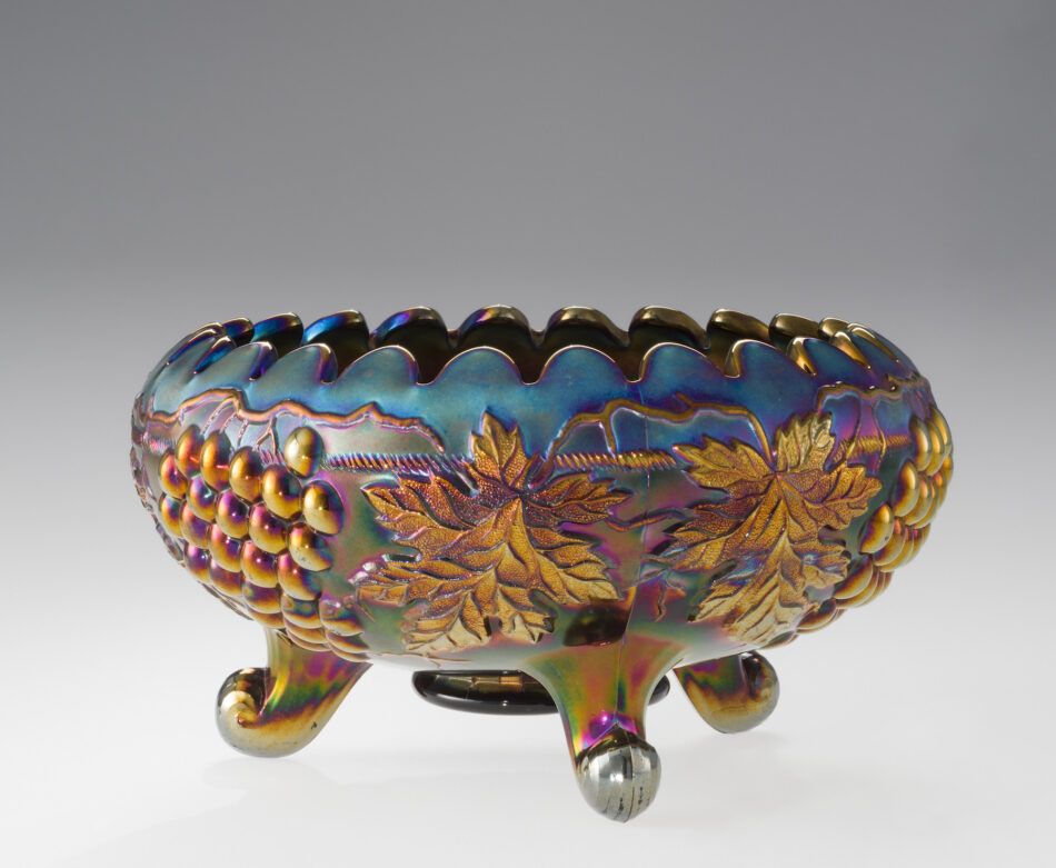 An amethyst-colored bowl with an iridescent finish in the exhibition "Brilliant Color" at the Corning Museum of Glass