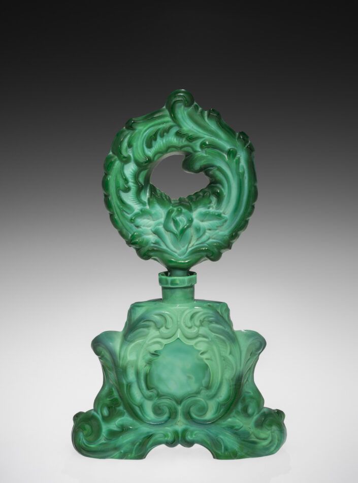 A green glass perfume bottle in the exhibition "Brilliant Color" at the Corning Museum of Glass