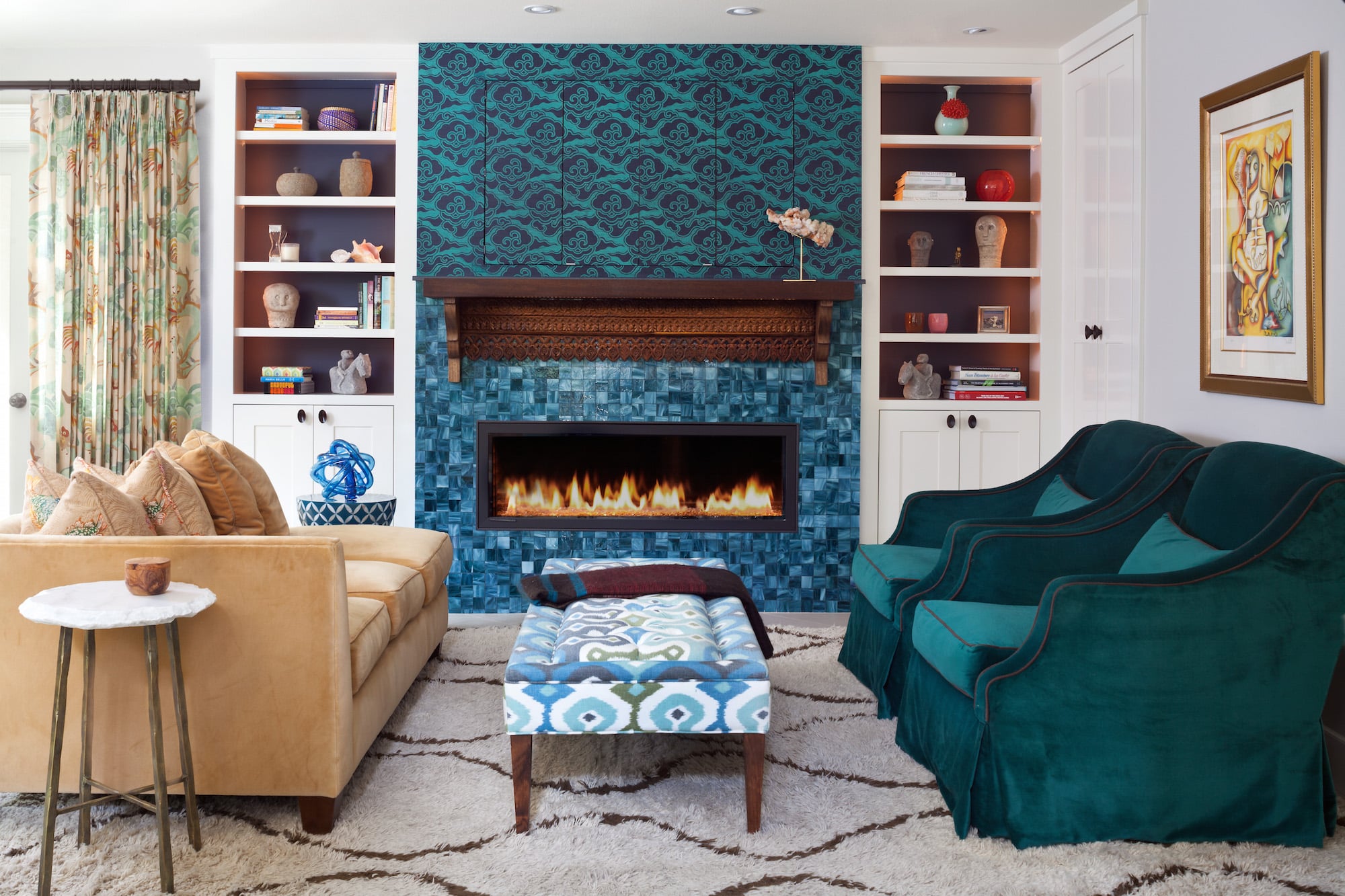 A Phillip Jeffries wallpaper helps to make the hearth a conversation starter. Carleton V’s Puff drapery fabric and a Tibetan Wave shag rug from David E. Adler lend quieter patterns in the background. Photo by Emily Minton Redfield