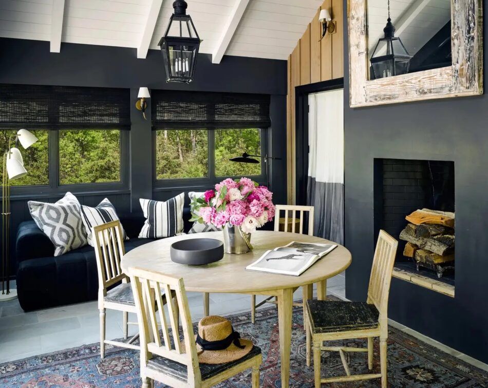 A black screened porch by interior designer Estee Stanley
