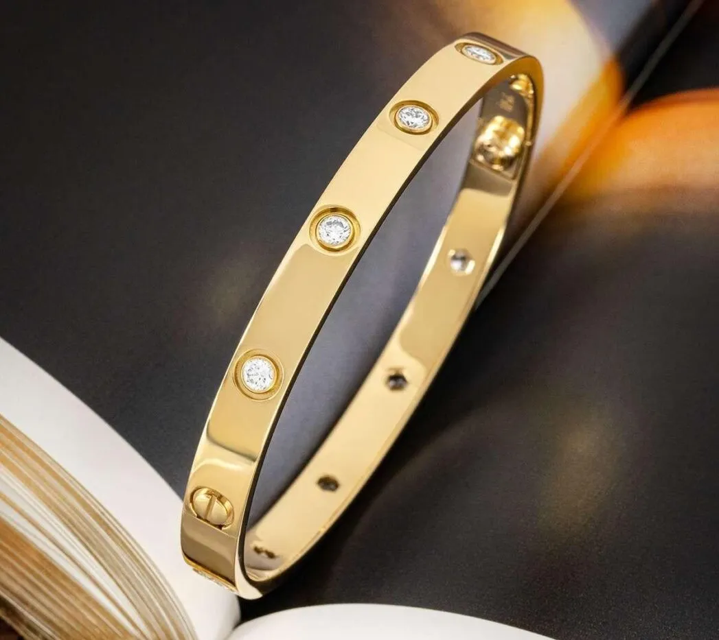 An 18-karat yellow-gold Cartier Love bracelet with ten round brilliant cut diamonds propped up on a the pages of a book. 