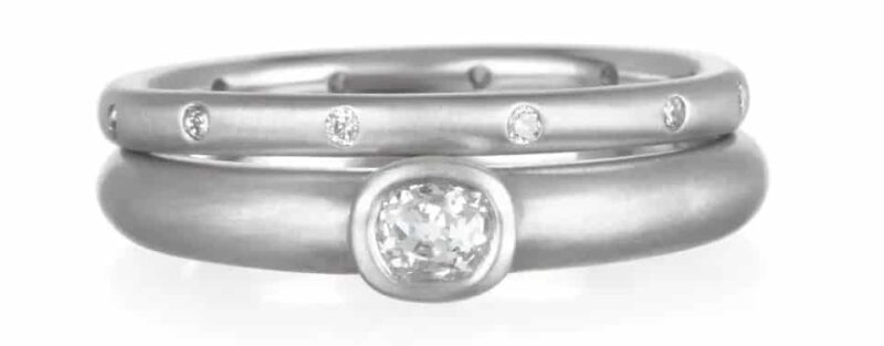 Faye Kim platinum and diamond eternity band, 2020, and platinum bezel-set-diamond ring, 2019