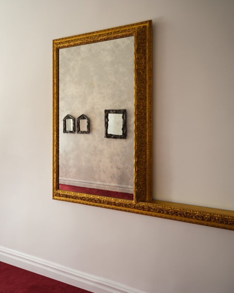 Works by Simone Bodmer-Turner are seen reflected in Paul Cocksedge's Louiiiis at Emma Scully Gallery. Photo: Joe Kramm