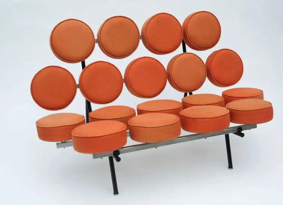 An orange George Nelson for Herman Miller Marshmallow sofa