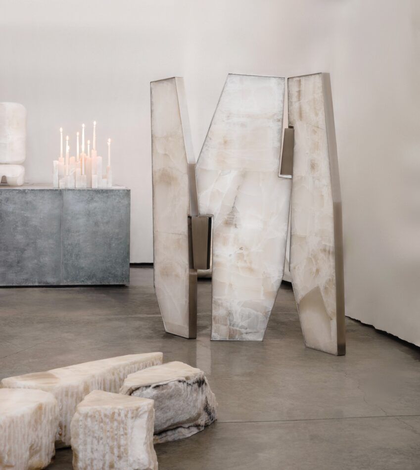White-onyx furniture from Galerie Philia's "Materia Perpetua" exhibition at interior designer Giampiero Tagliaferri's Los Angeles studio, including a lamp by Victoria Yakusha, a candelabra by Andrés Monnier, a screen by Tagliaferri and a table by Monnier