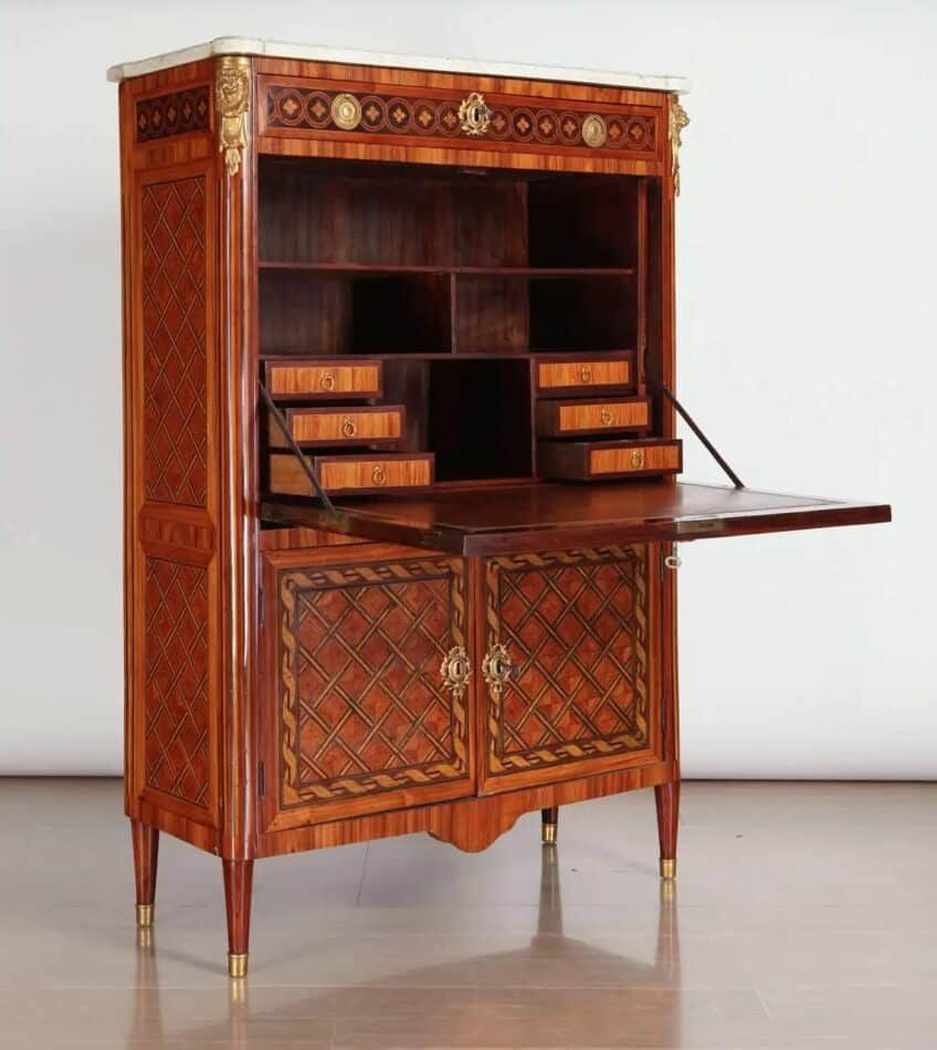 An antique French ormolu-mounted secrétaire à abattant with elaborate marquetry