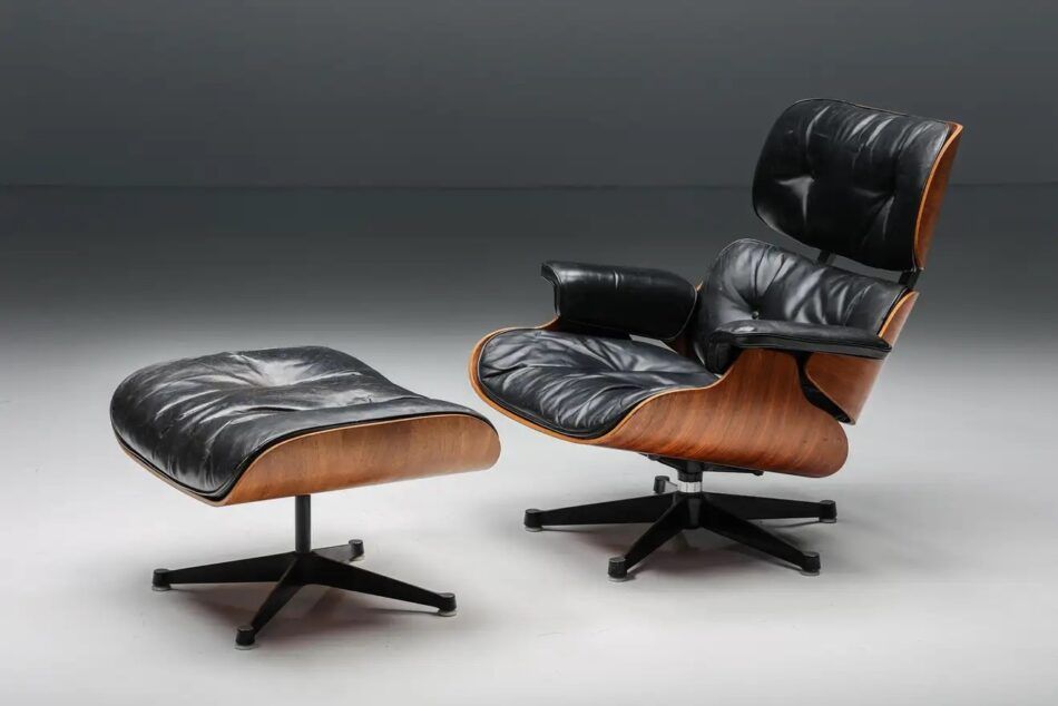 A Herman Miller Eames Lounge Chair and Ottoman in black leather