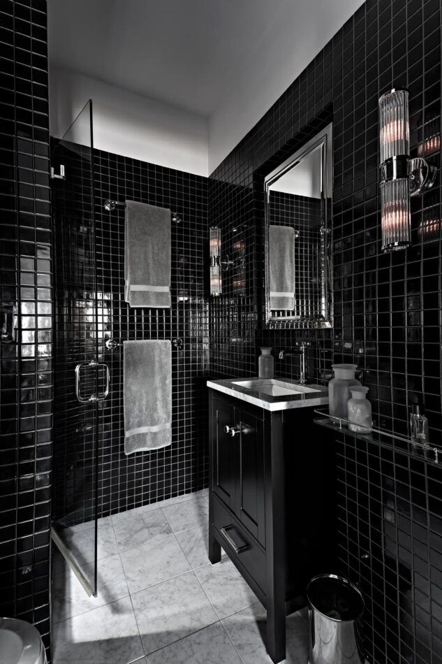 A black bathroom by interior design firm Gramercy Design