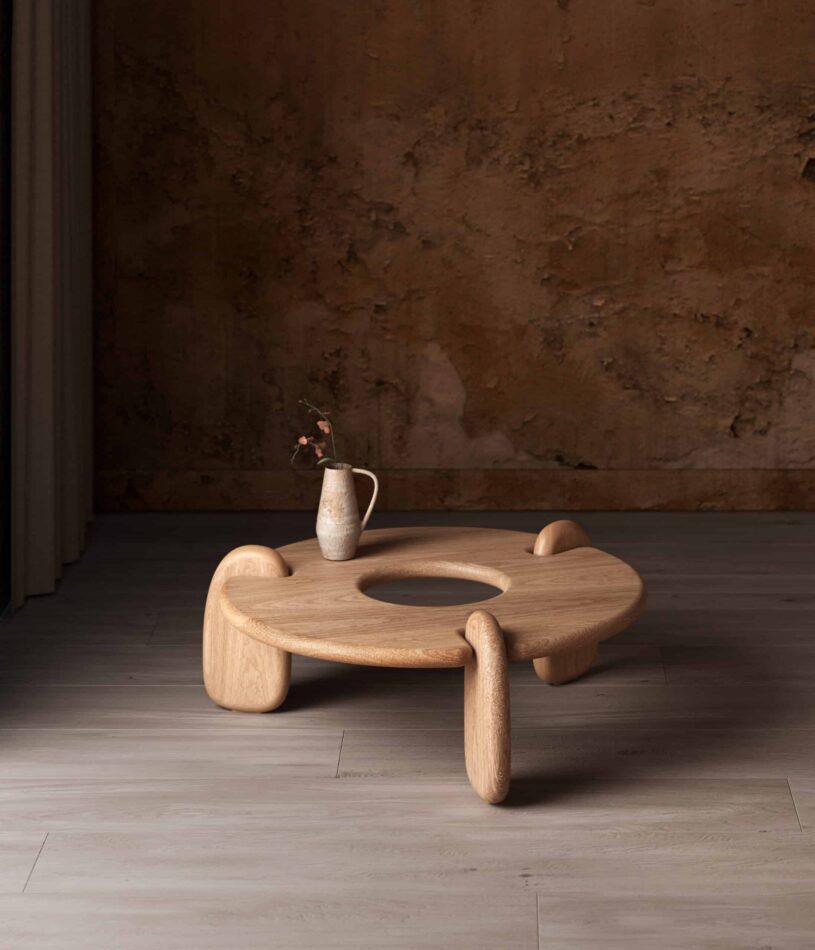 Objects & Ideas Henge Coffee Table in White Oak with a vase of flowers on top