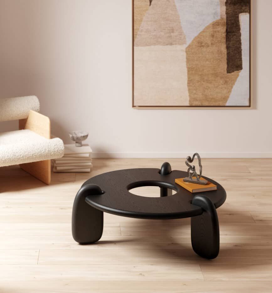 Objects & Ideas ebonized-ash Henge coffee table with brown toned painting behind it